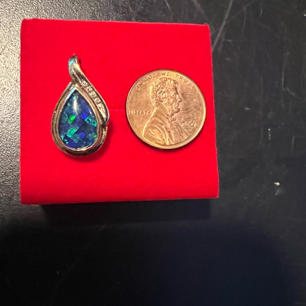 14 k gold, diamond, and opal pendant